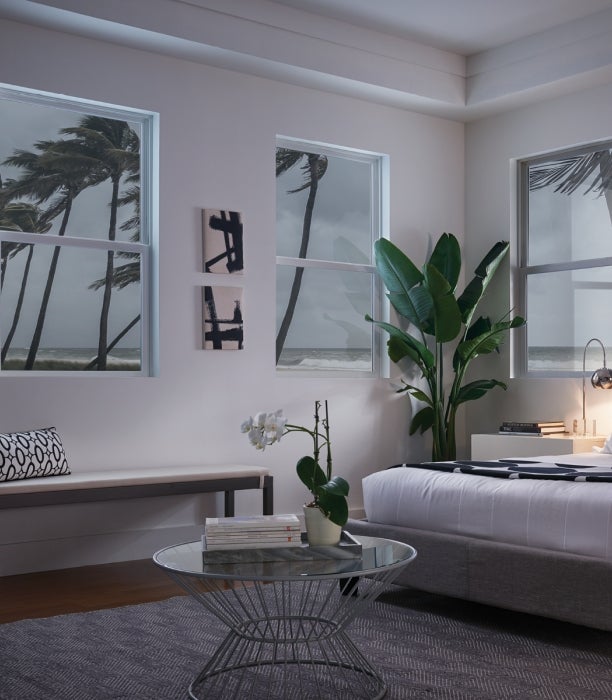 A photo from inside a bedroom while outside is a hurricane.