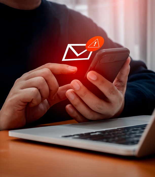 System hacked red warning alert, email hack, scam malware spreading virus on message alert virtual on mobile phone screen in person hand 