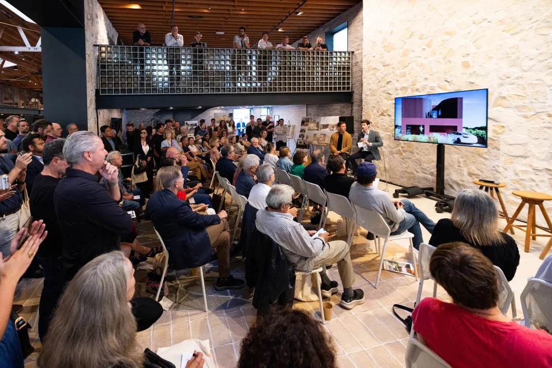 Guests view a presentation on the Case Study 2.0 initiative.