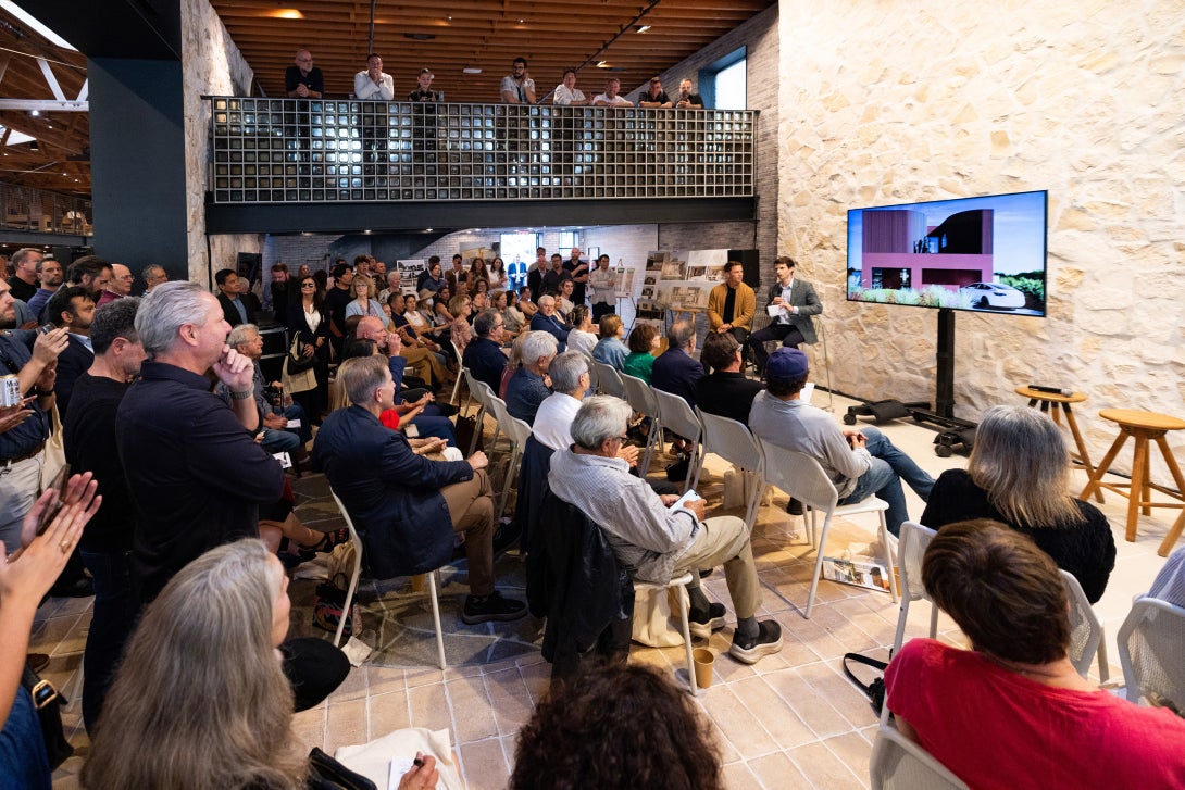 Guests view a presentation on the Case Study 2.0 initiative.